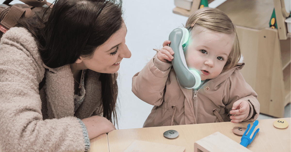 child and parent using toy phone