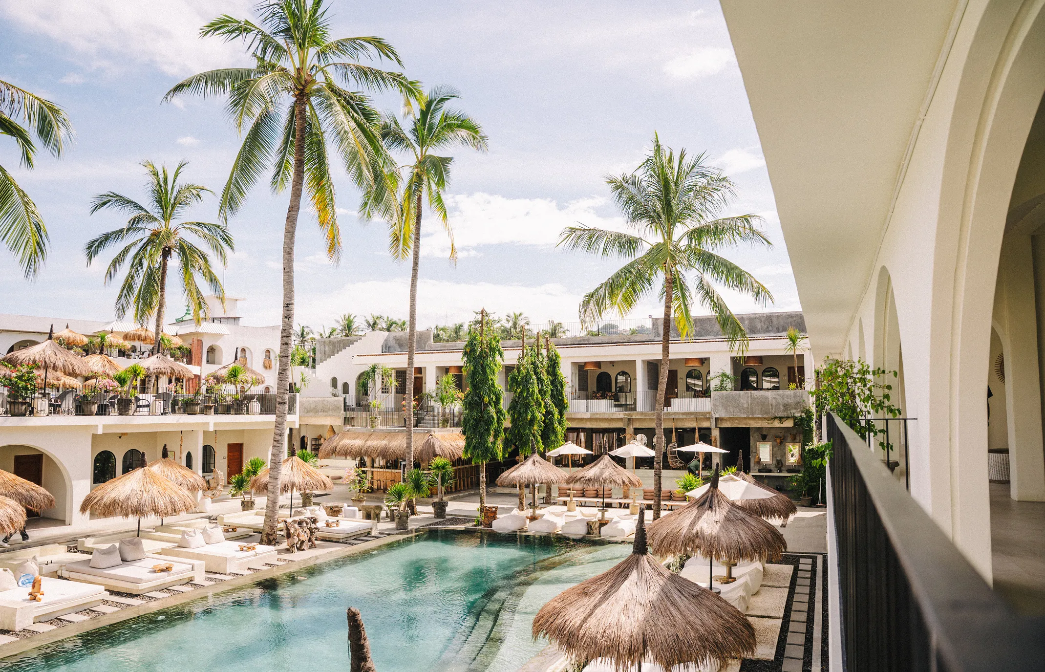 A portrait of famous dressage rider Lina Dolk, looking into the camera, standing next to her horse Hpnotic MJ.