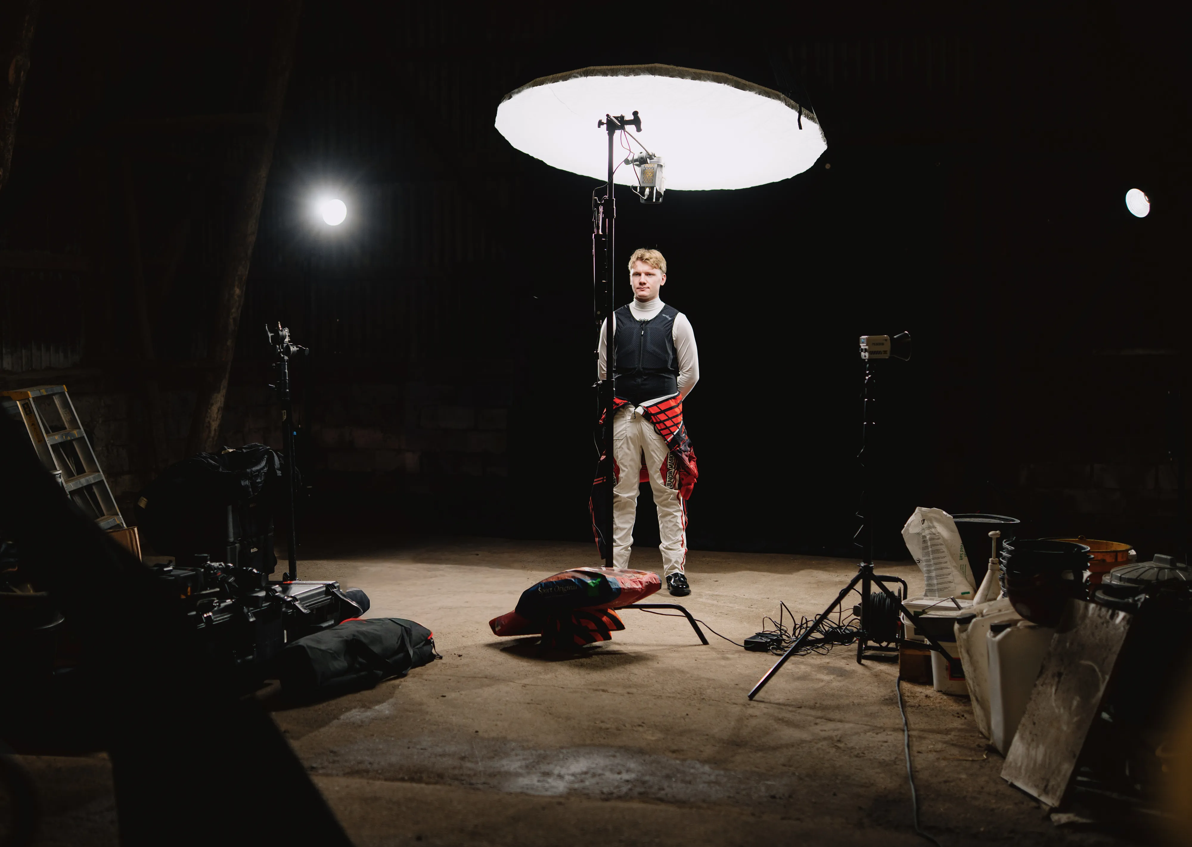 A leather loafer, without an outsole, lying on a desk in a modern workspace. On the desk are also some tools for measuring exact millimeters.