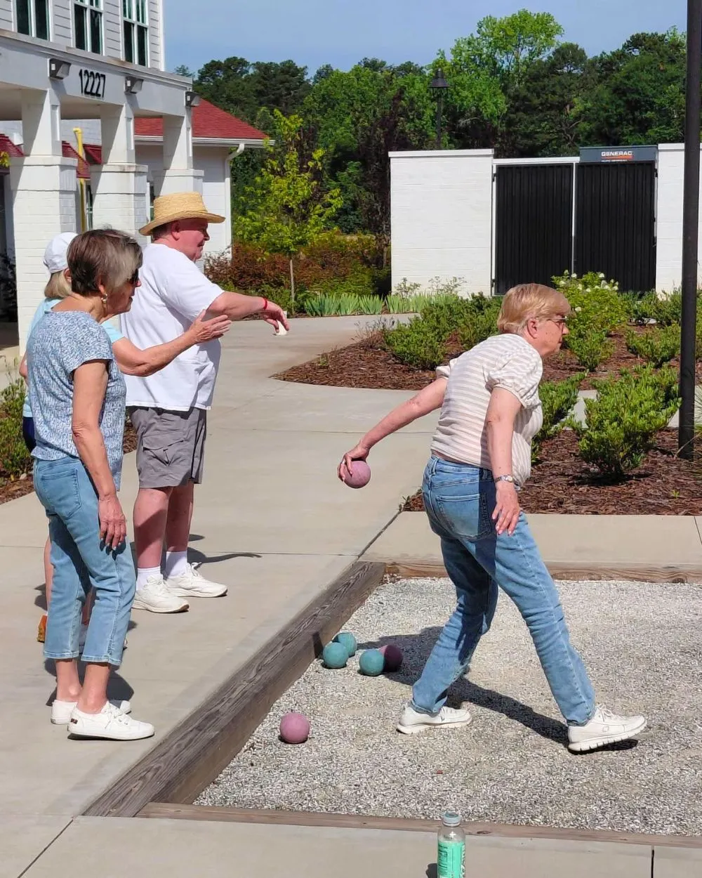 Symphony Park residents play bocce ball on the community court.