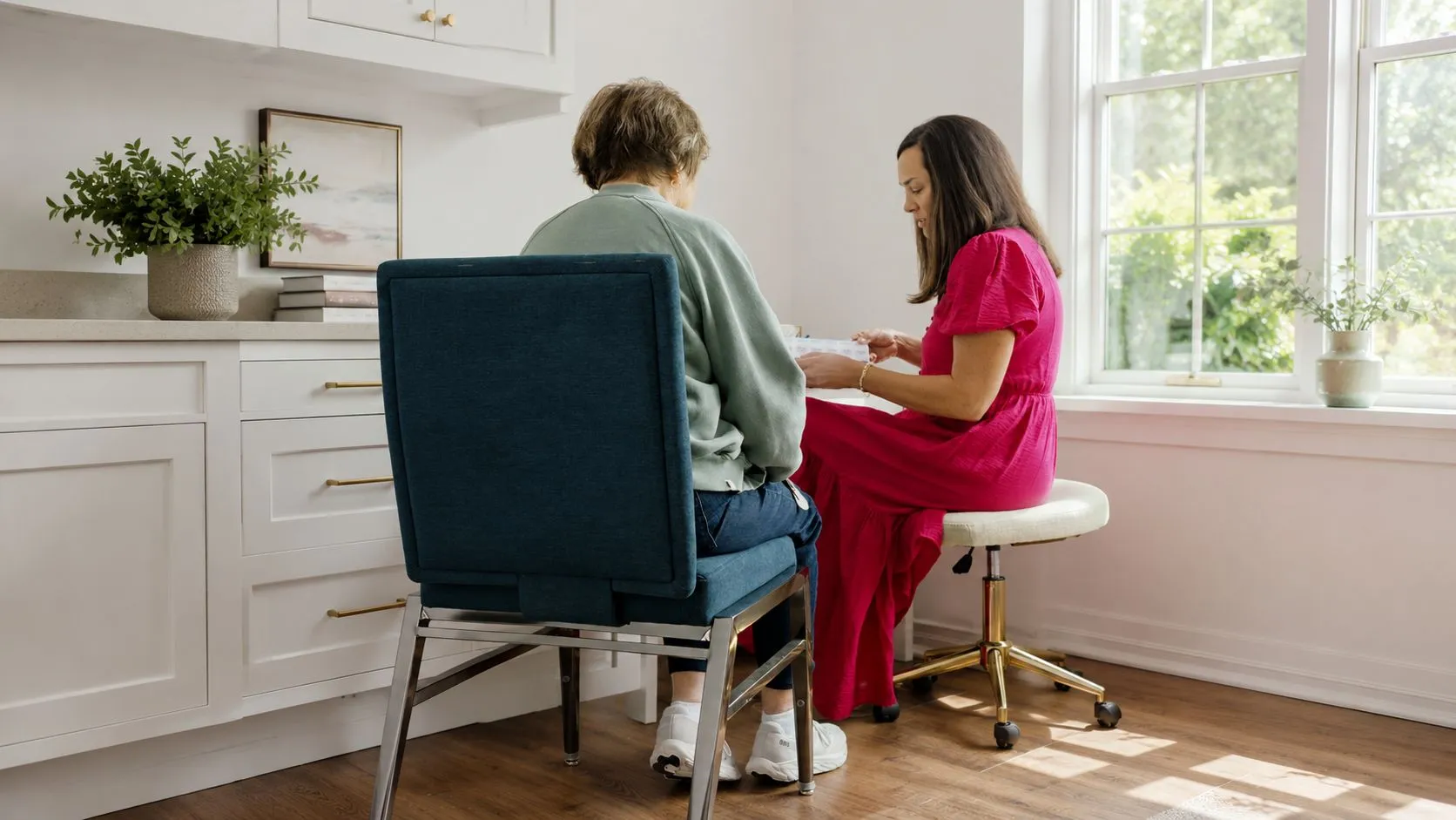 A Home Careonlina healthcare provider meets with a resident at Symphony Park.