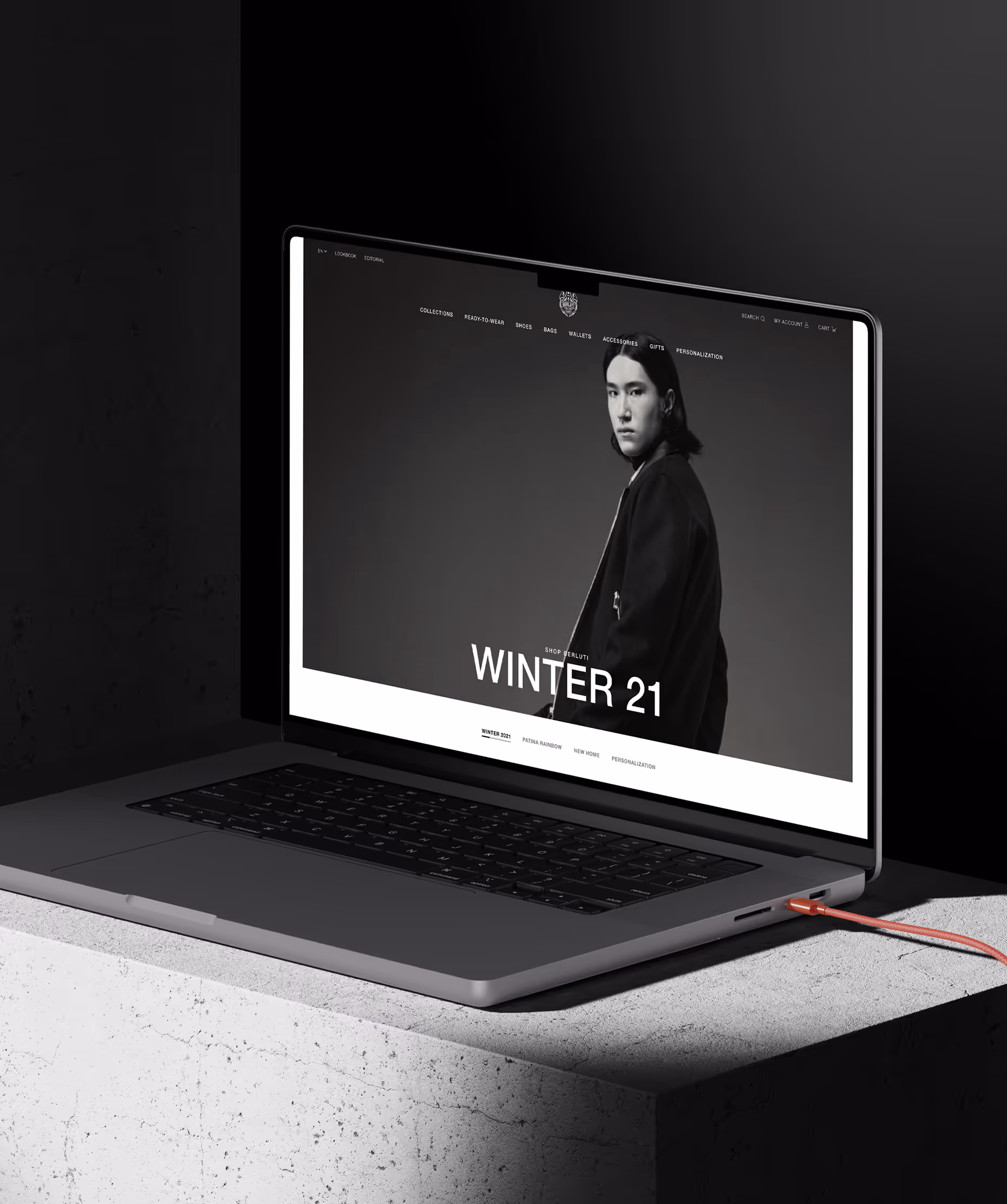 Berluti luxury brand website homepage with minimal black-and-white design.