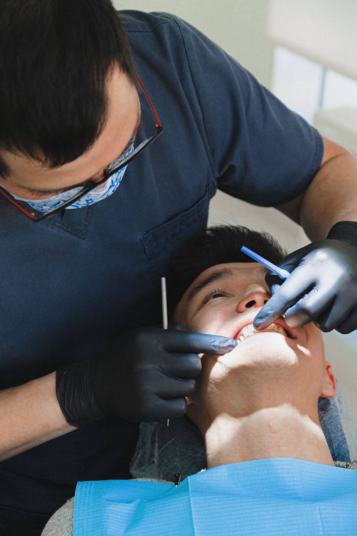 Dentist examining a patient during a dental check-up