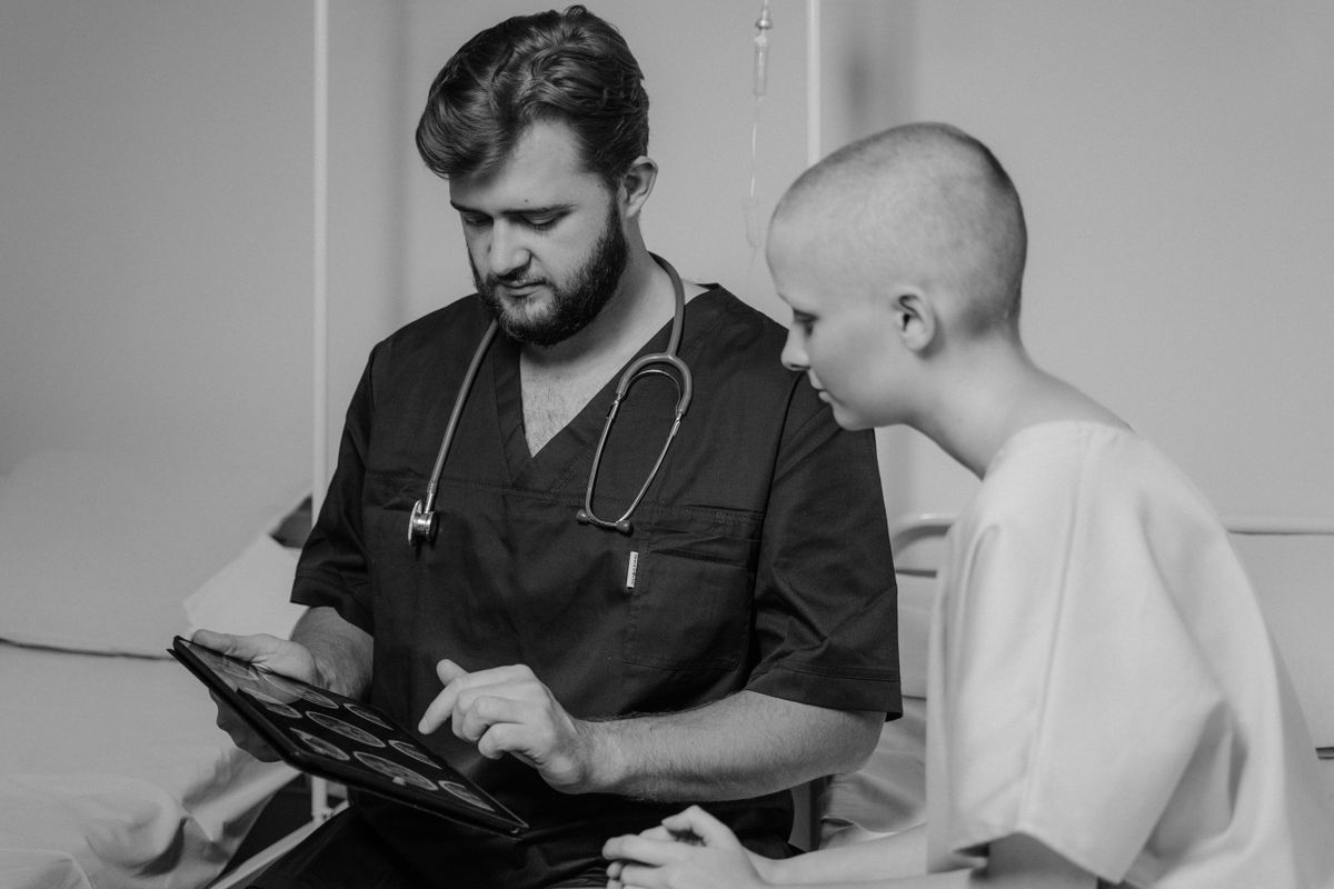 Surgeon reviewing options with a patient during a consultation