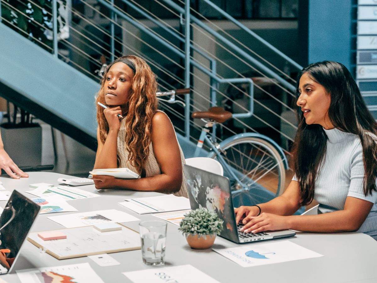 Team reviewing plans together at a desk