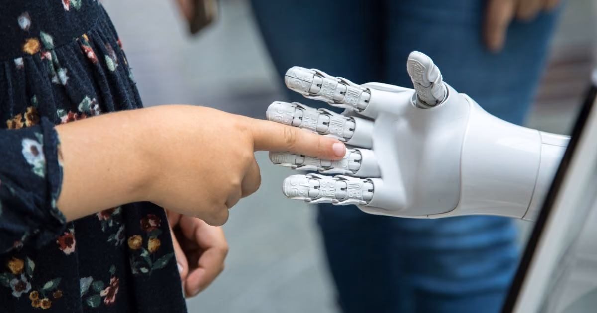 Robot shakes hands with a child
