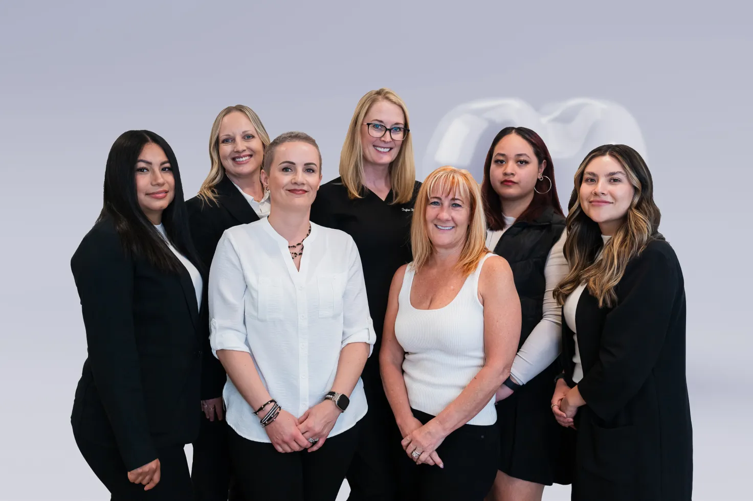A group of women standing next to each other.