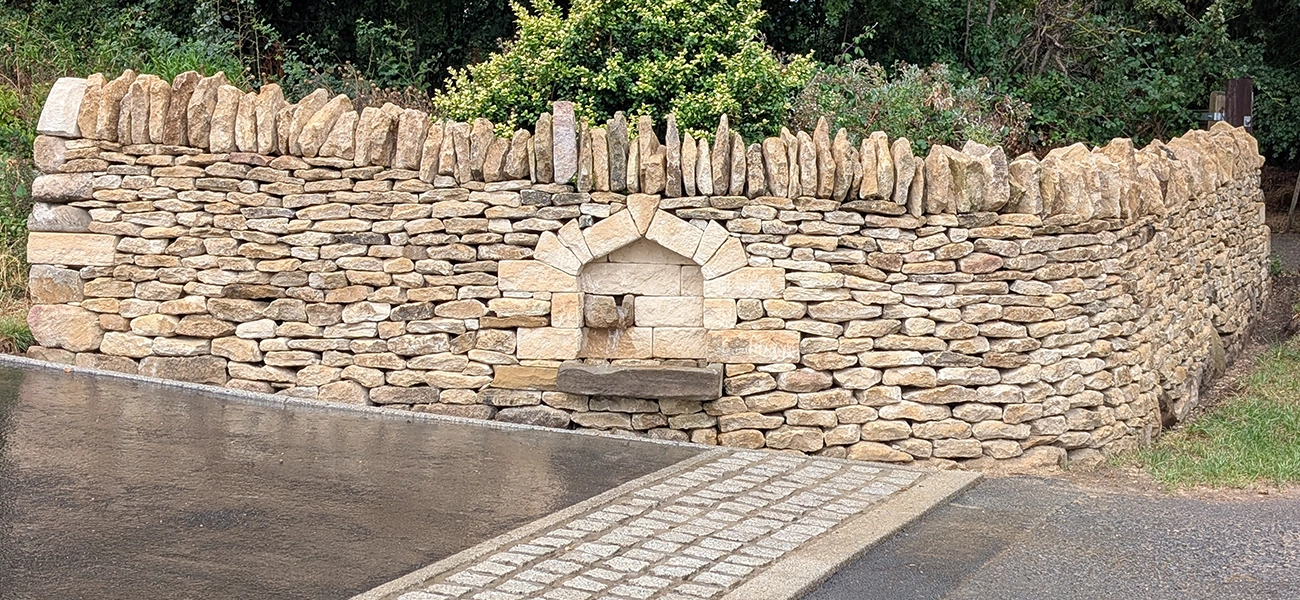 A dry stone well feature we built into a new wall