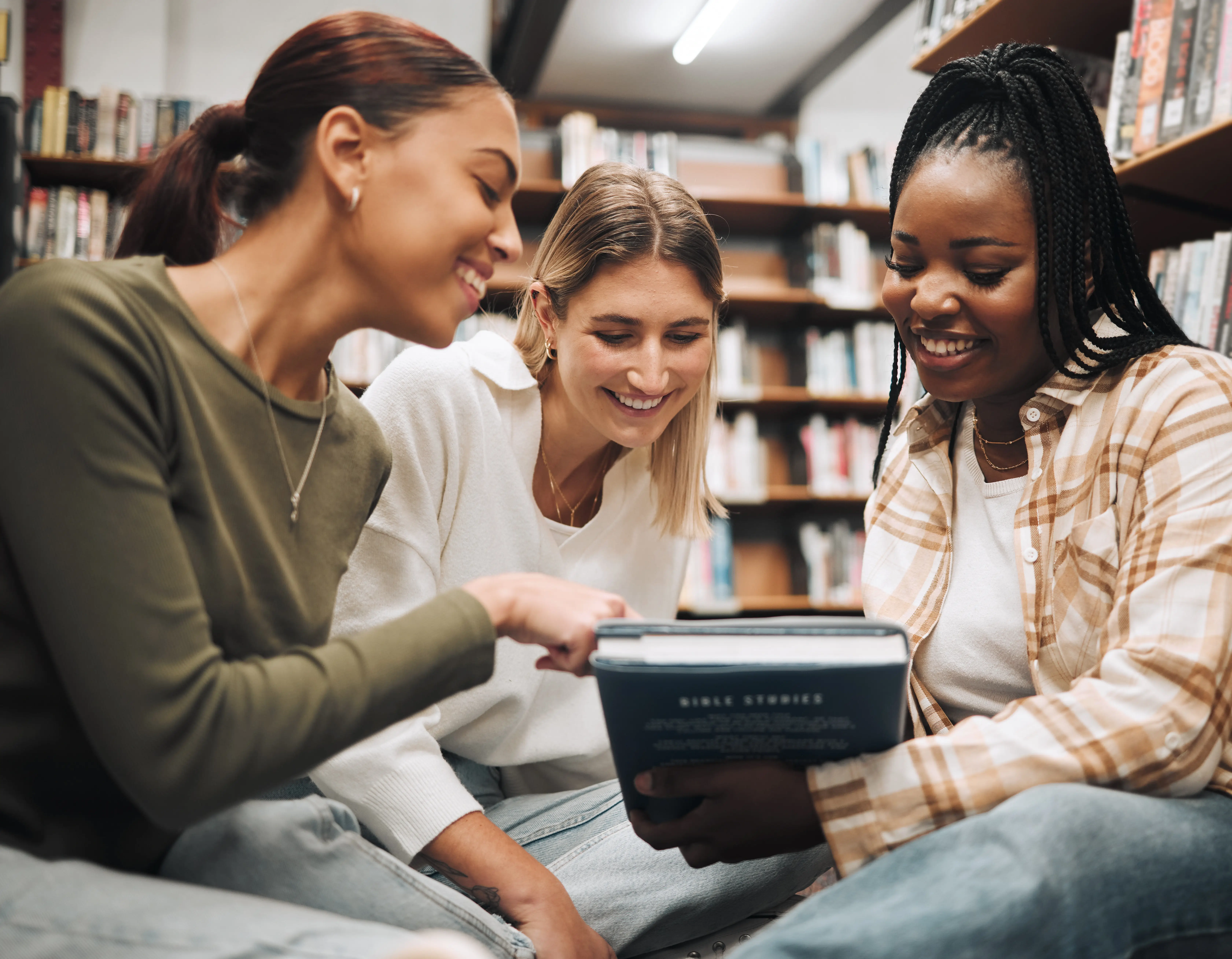 two girls reading in a romance book club