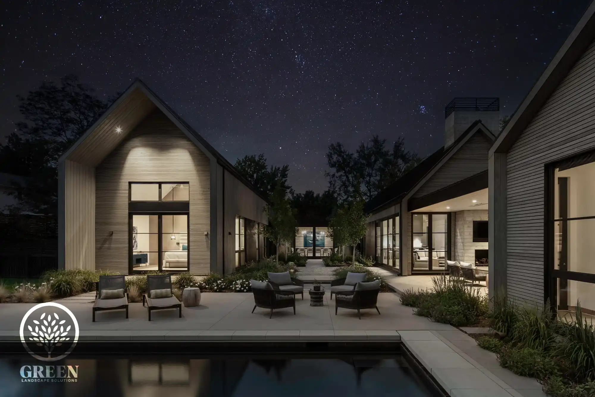 A residential landscape design by Green Landscape Solutions in Boulder at night.