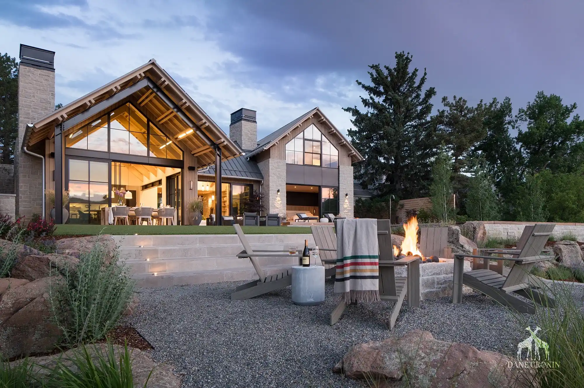 A residential landscape design featuring a fire pit by Green Landscape Solutions in Boulder, Colorado.