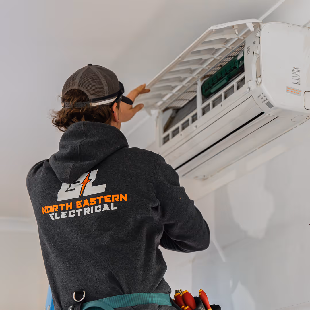 B&L Electrician installing an air conditioner in a Wangaratta home