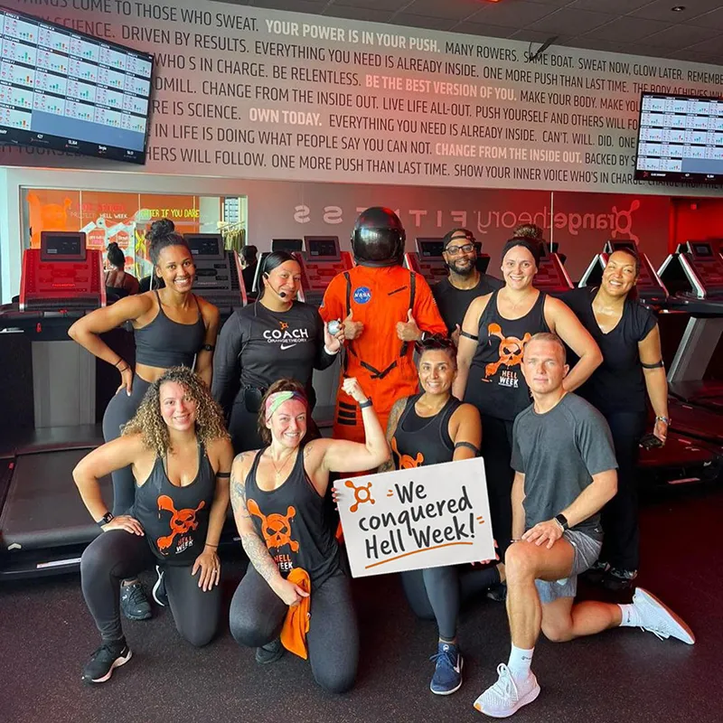 End of Orangetheory fitness group class with Hell Week signage