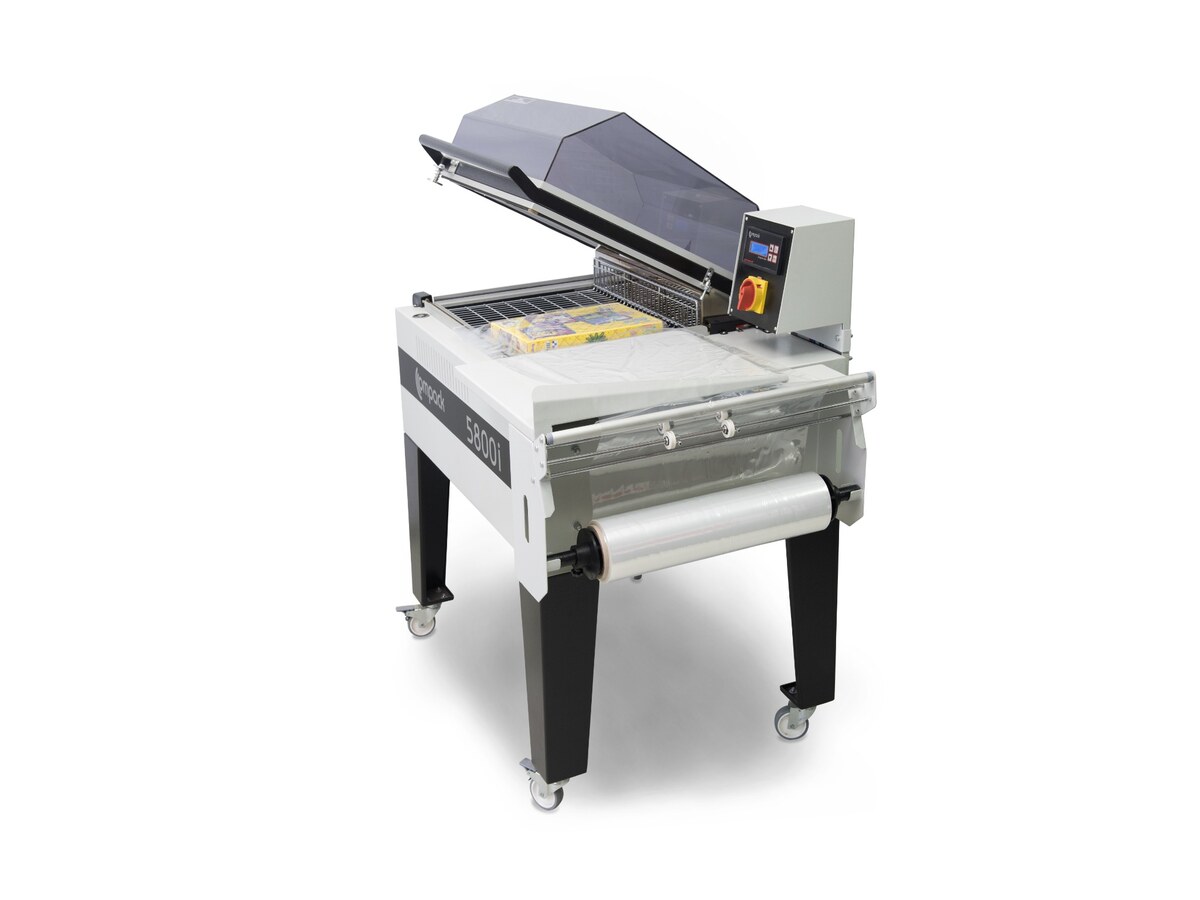Chamber shrink wrapping machine with centre-folded film loaded