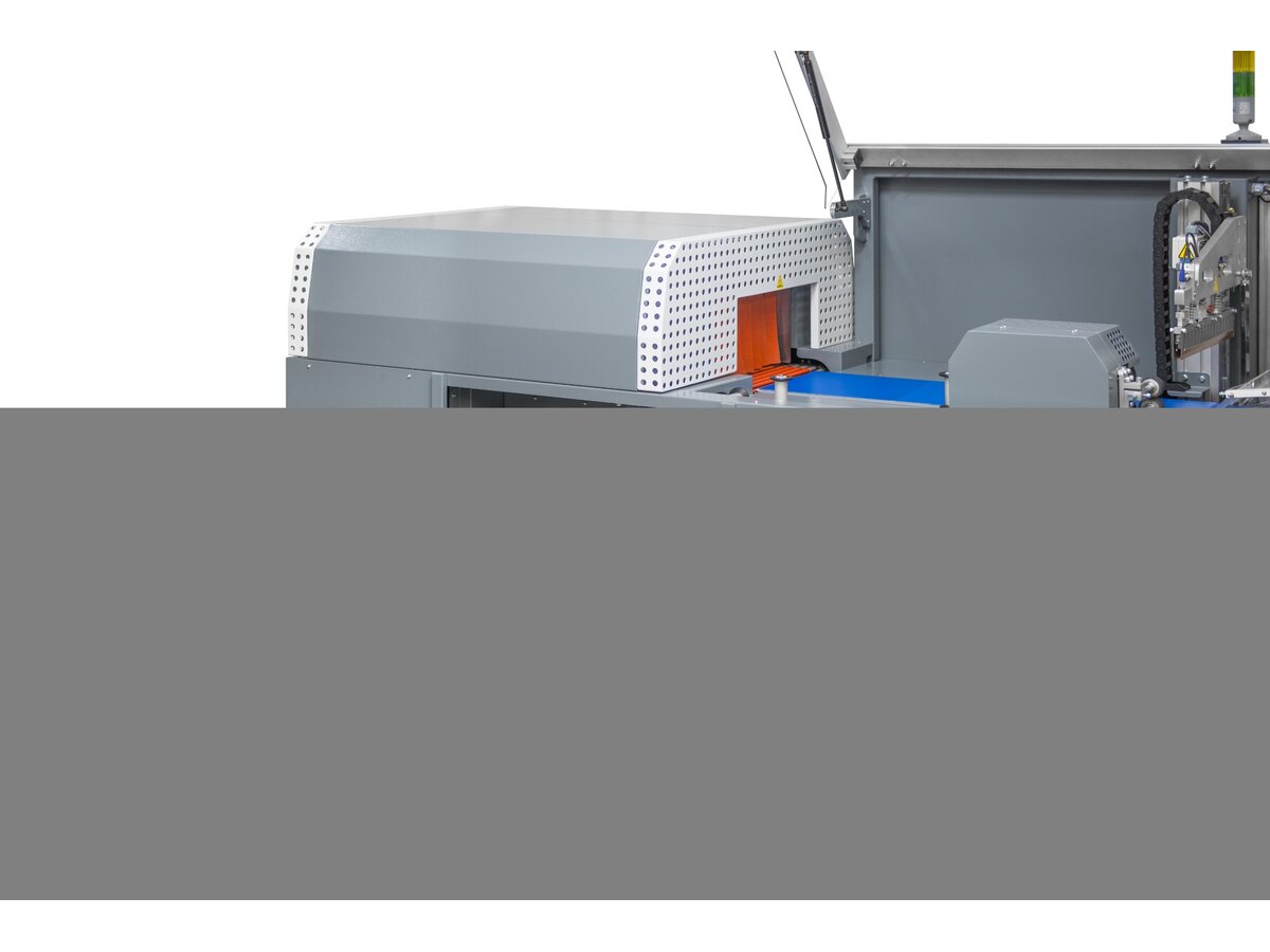 Integrated shrink tunnel and film handling module