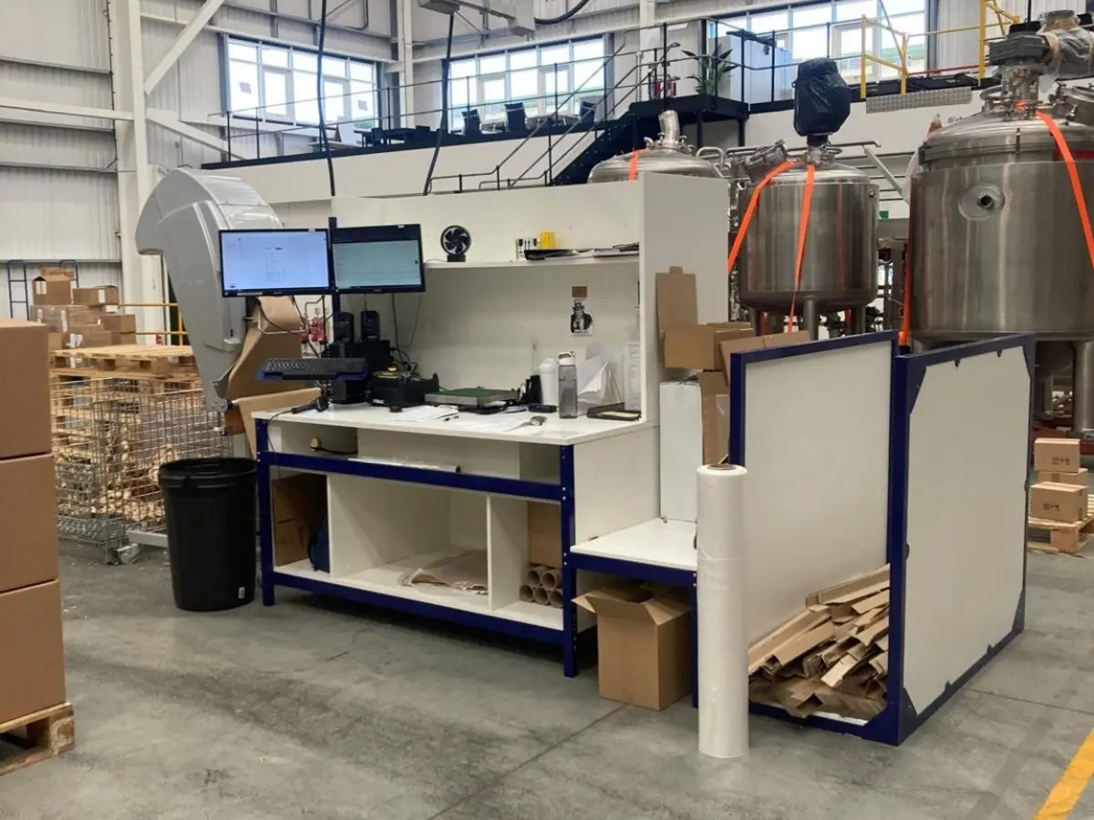 Configured pack bench used in a cosmetics fulfilment operation