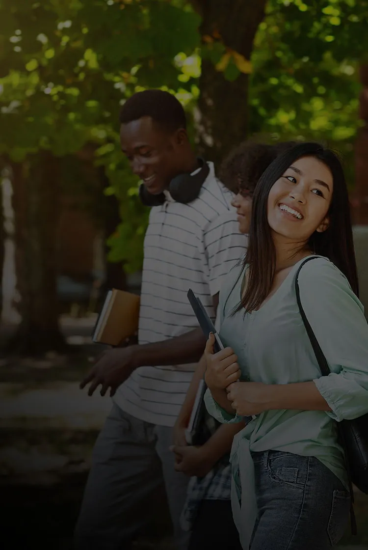 group of college students walking together on campus