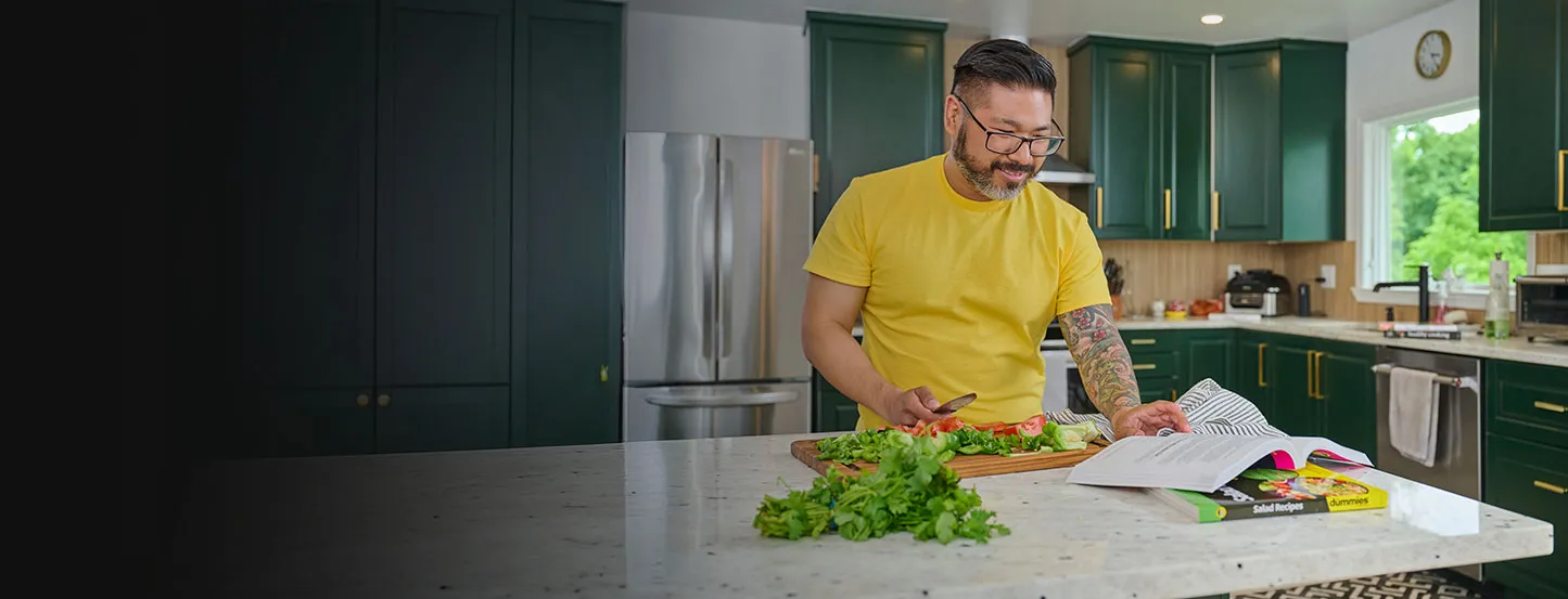 Man preparing recipe from Gut Health For Dummies