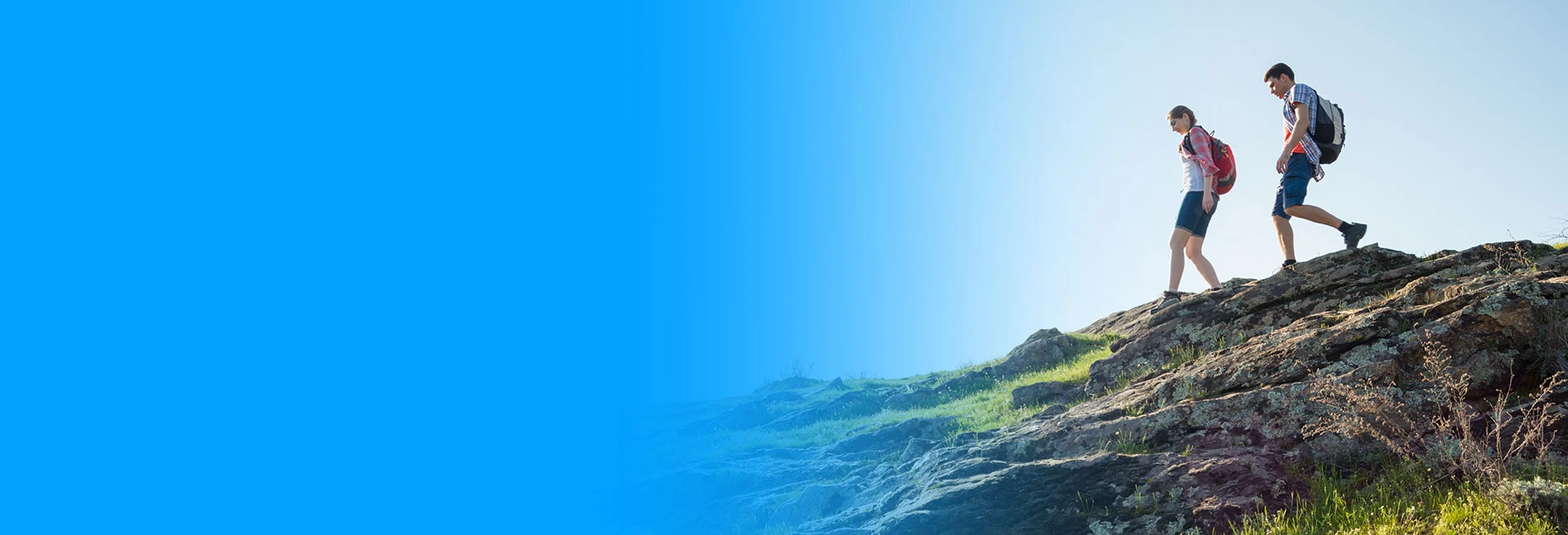 couple hiking on a bright sunny day