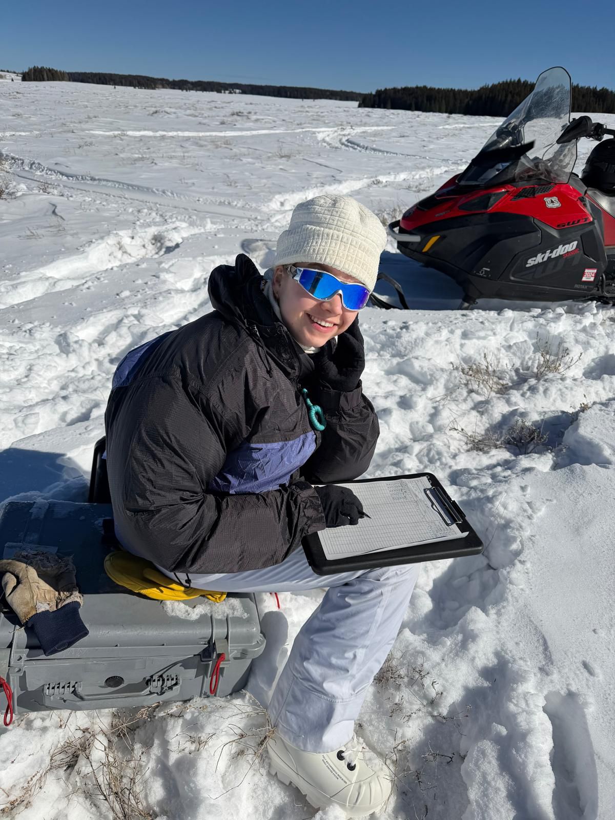 Writing down the measurements in the field notebook.