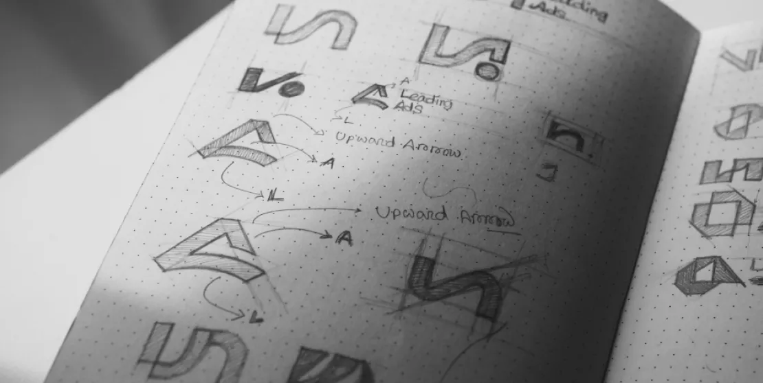Leading Ads logo sketches book by ofsapce