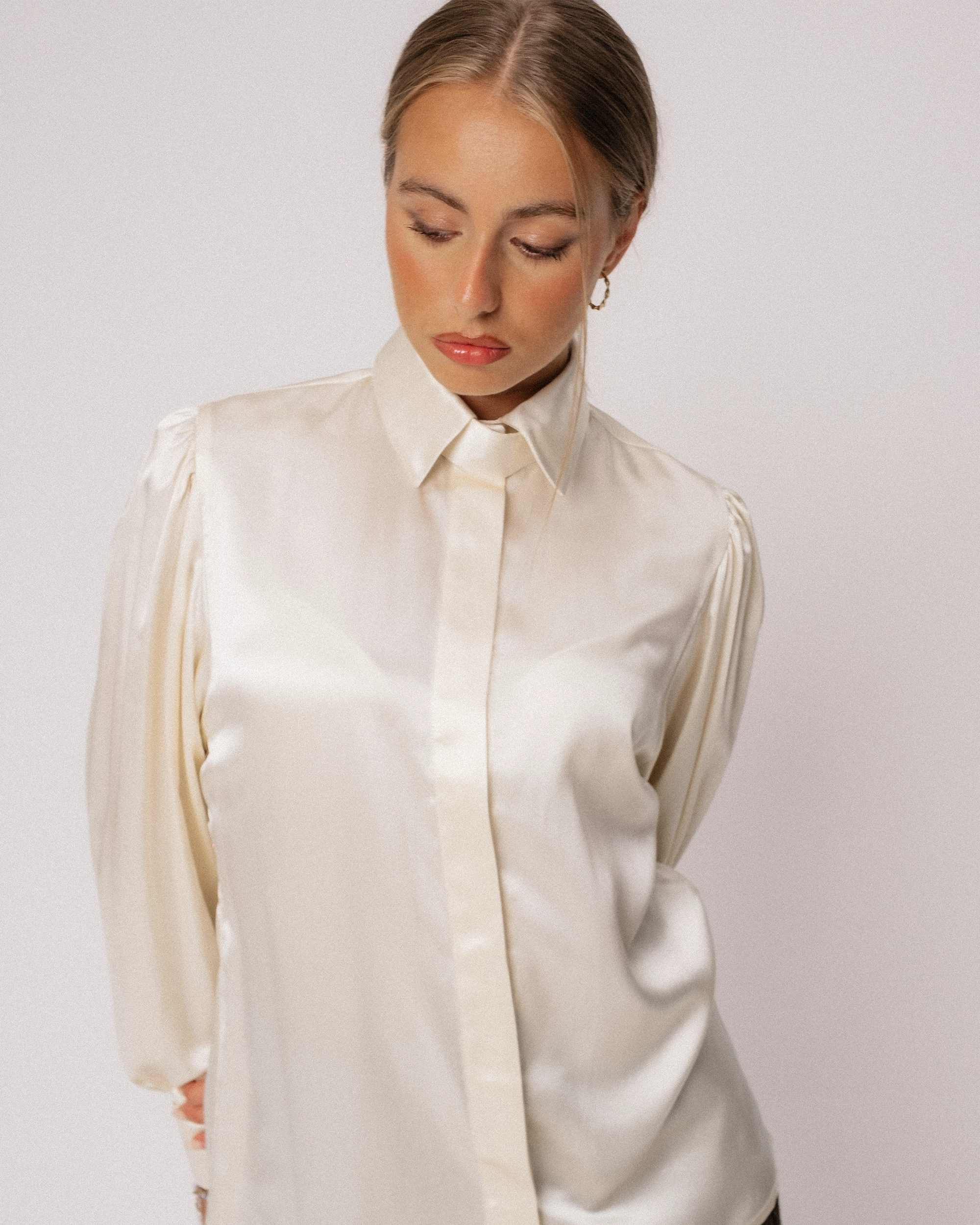 Front details and hidden buttons of the tailored in England, Chewton silk satin blouse