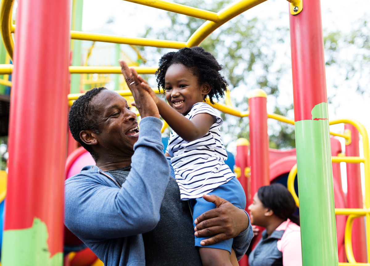 Happy father and daughter in a park