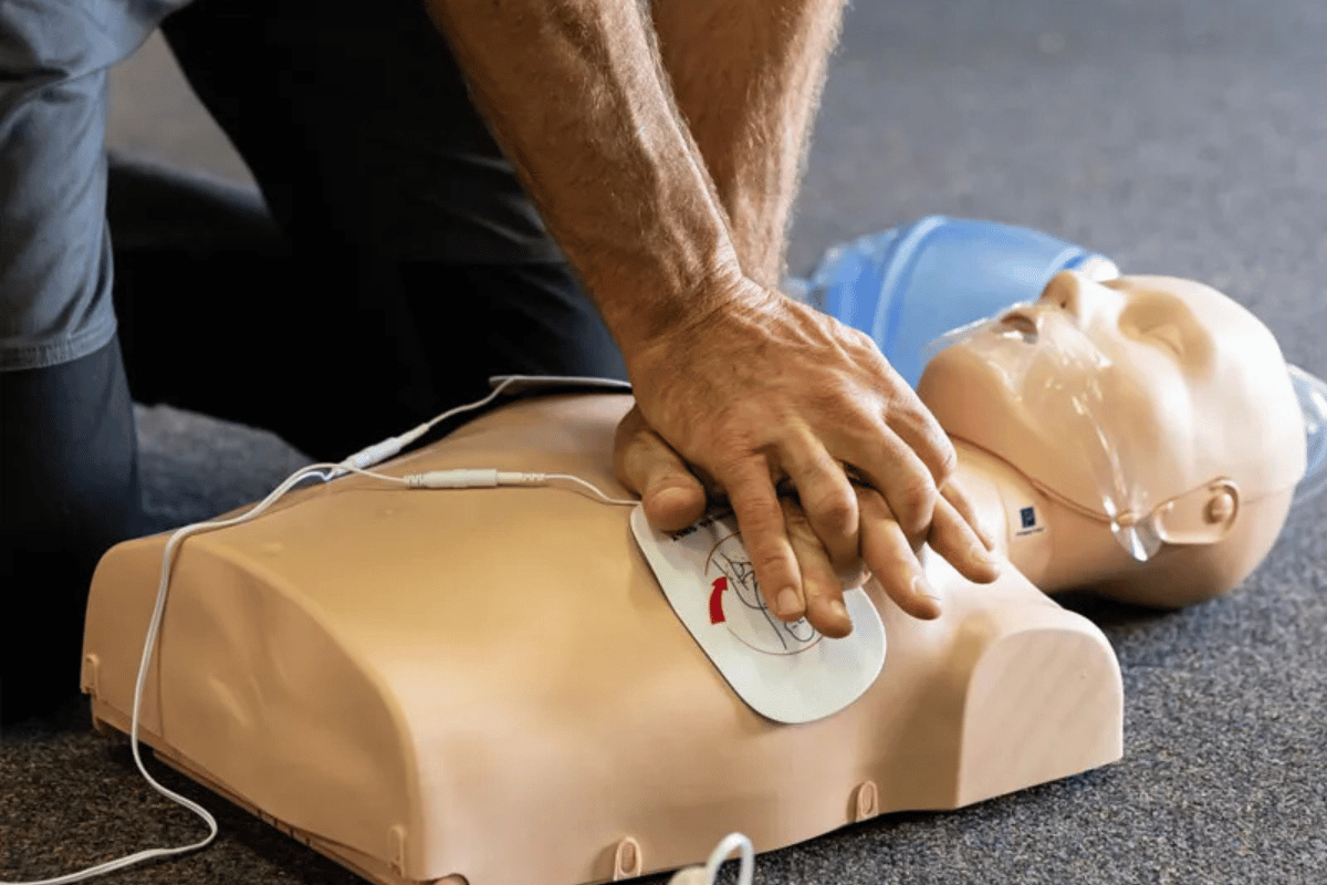 Hands-on first aid training at ETA Training Perth, practising CPR and emergency response techniques
