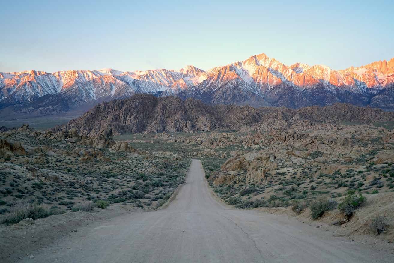 Desert road approaching the Sierra Nevada mountains