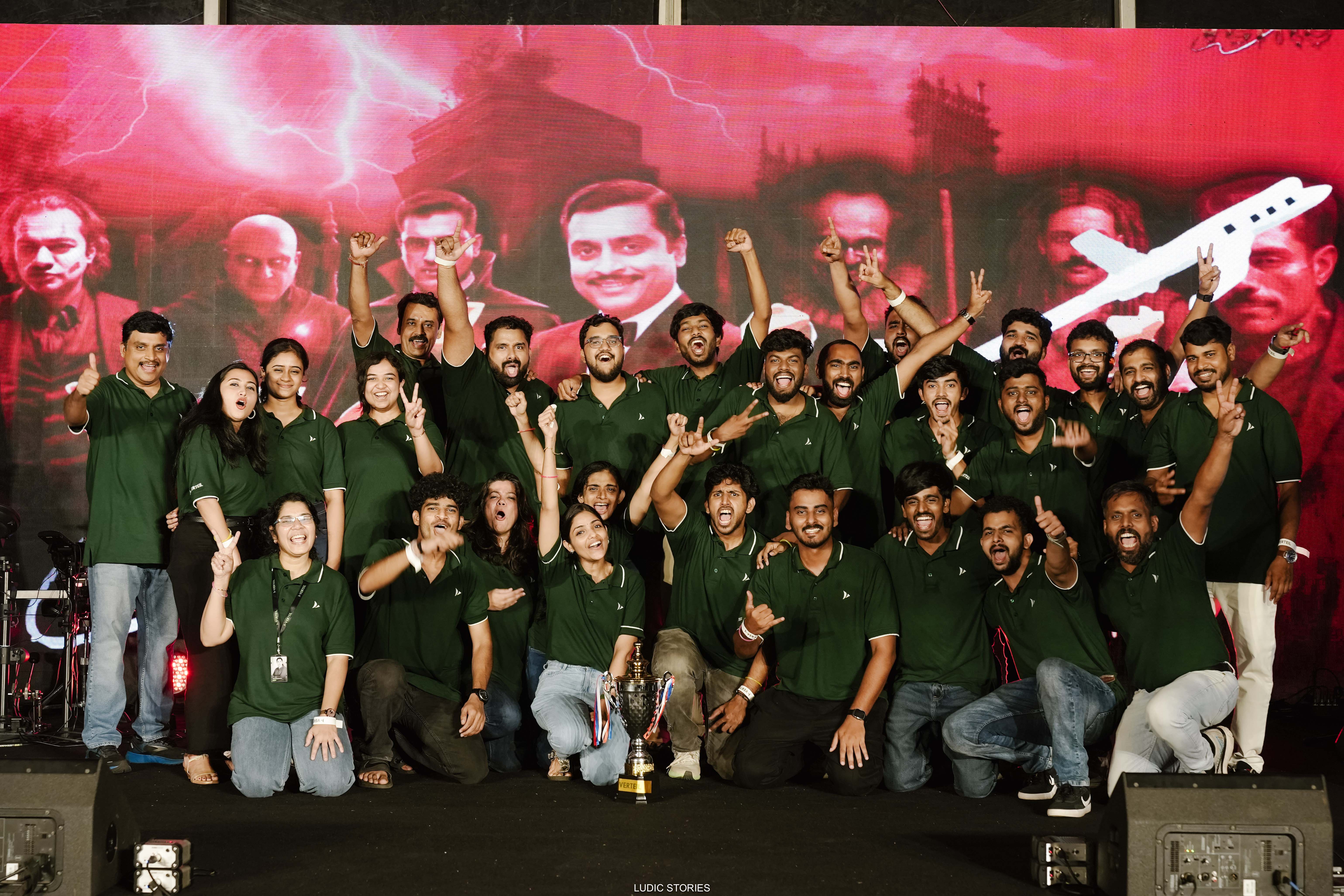 Members of Verteil team cheerfully accept an award