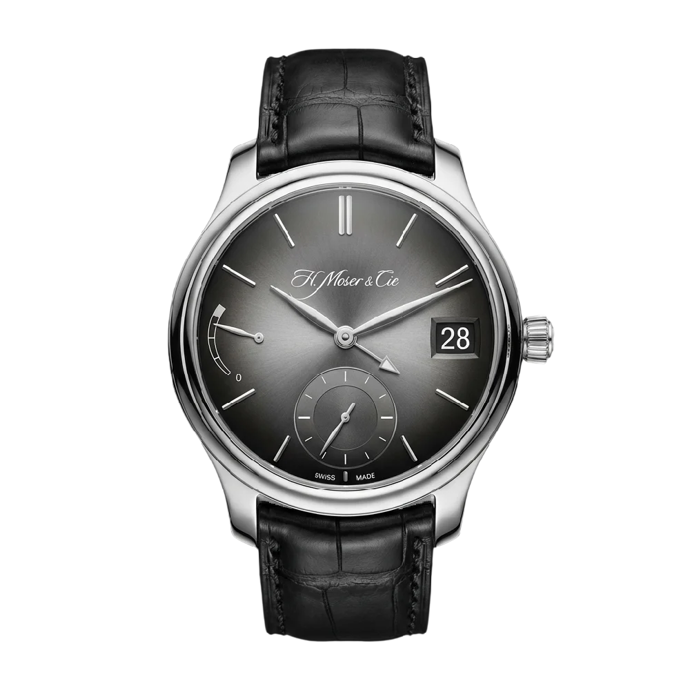 Close-up van een H. Moser & Cie Endeavour horloge met blauwe wijzerplaat op een donkere achtergrond.