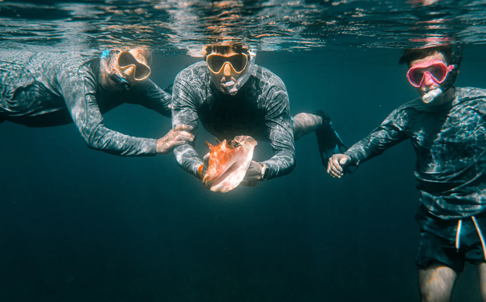 A couple of people that are in the water.