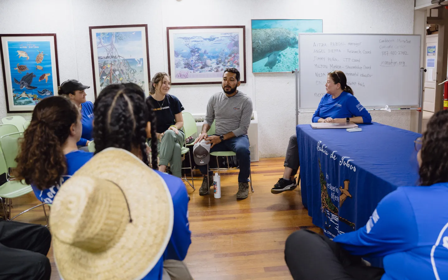 A group of people sitting around a table.