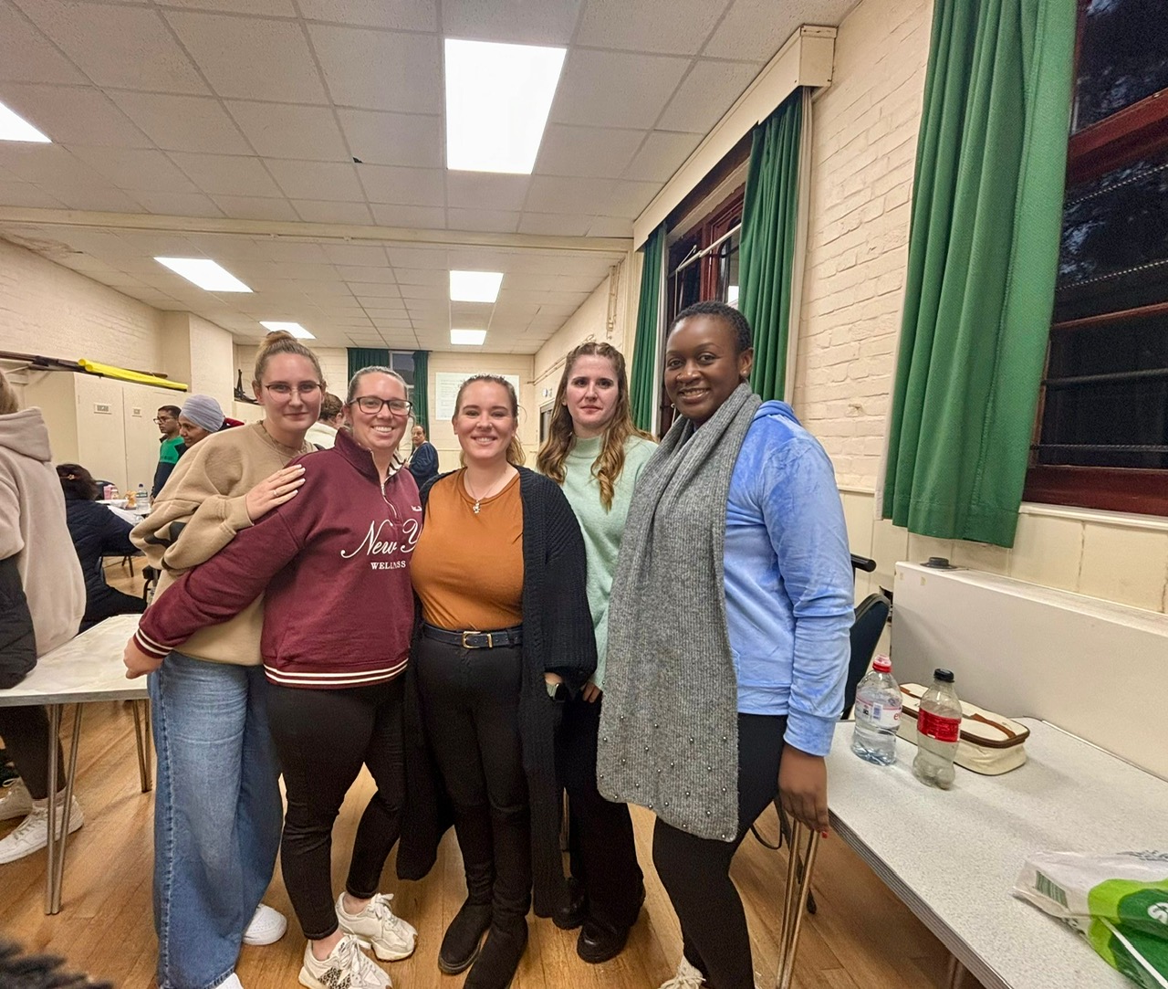 Five Care & Carers team members smiling together after completing the Level 2 Oliver McGowan Mandatory Training.