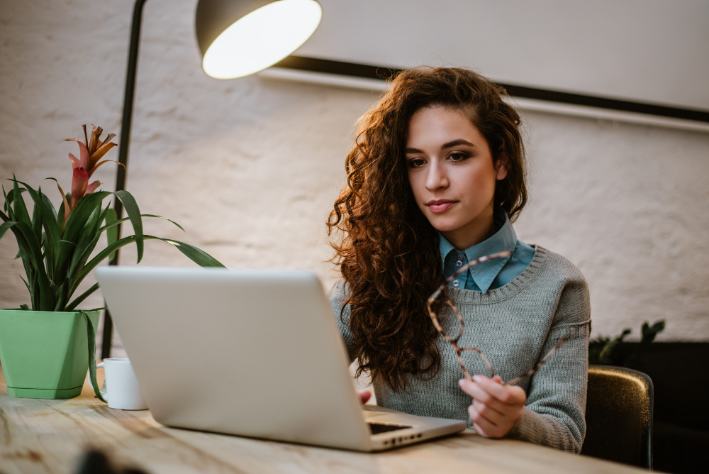 A woman working on a laptop