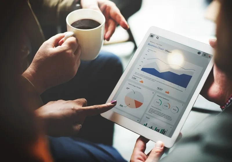 Team members looking at a tablet