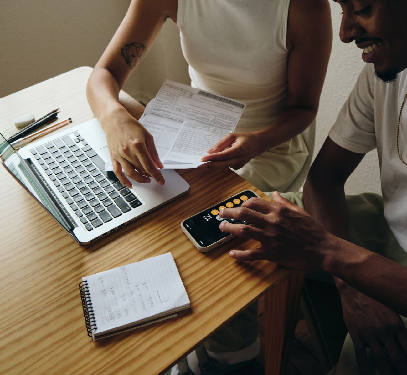 close up of two coworkers planning finances together