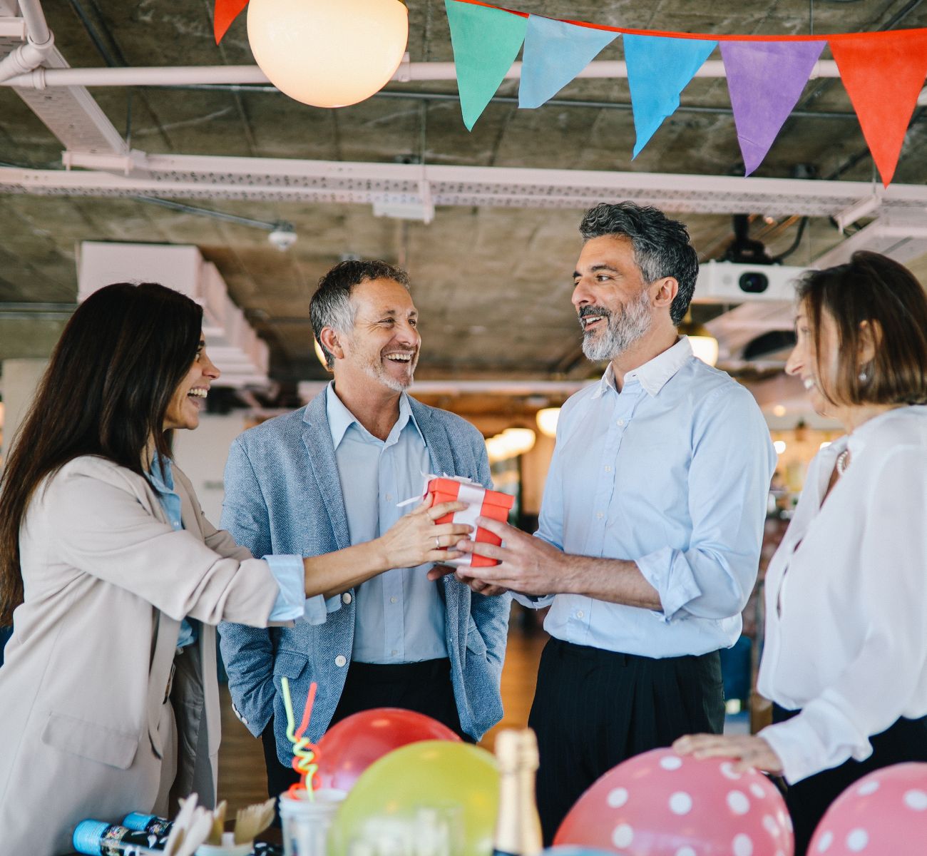 coworkers celebrate together in the office