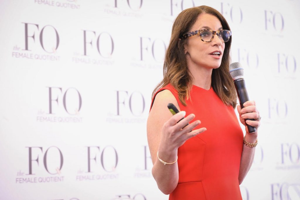 author erica keswin speaks to an audience at an event