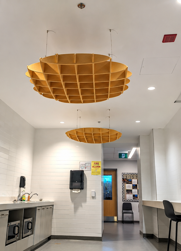 Black acoustic slat wall room with a phone booth pod in a Toronto office