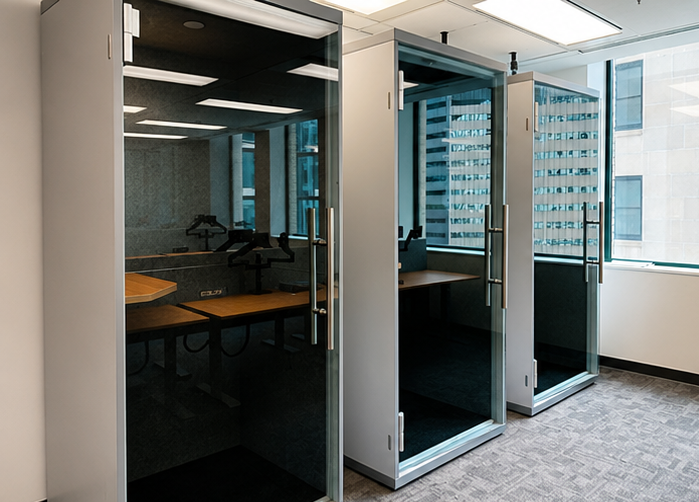 Glass-fronted office phone booths installed in a downtown Toronto tower