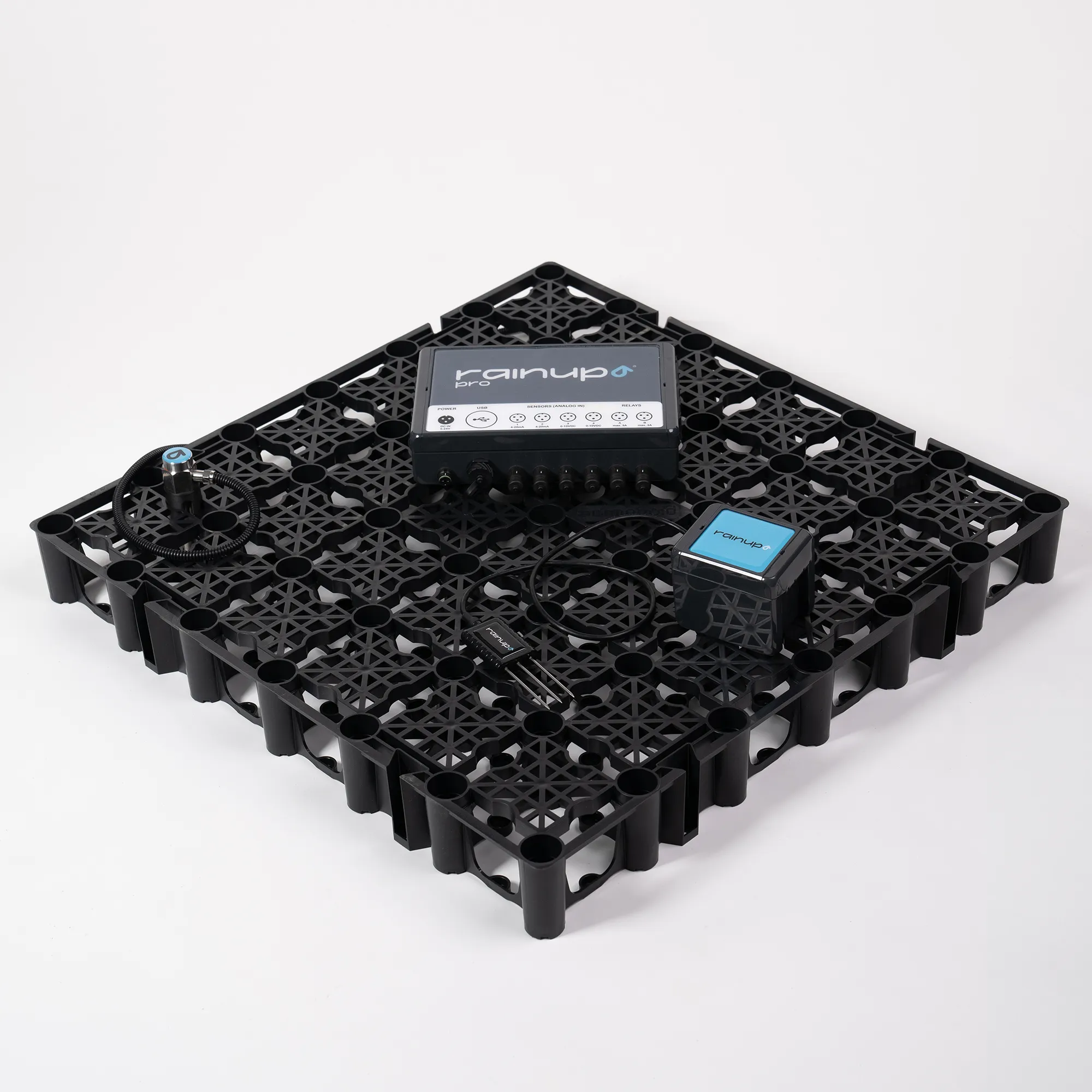 Rainup Pro sensor system mounted on a black perforated platform with connected cables and multiple sensor units.