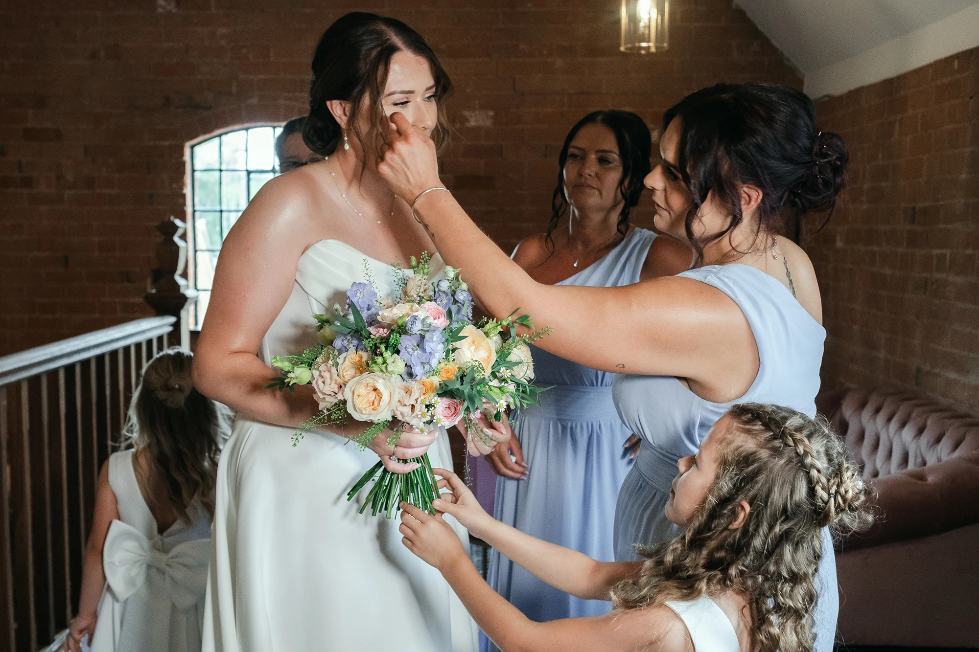 Bride with her bridesmaids and flower girl before the ceremony at Blackbrook Barns, Lichfield, Staffordshire