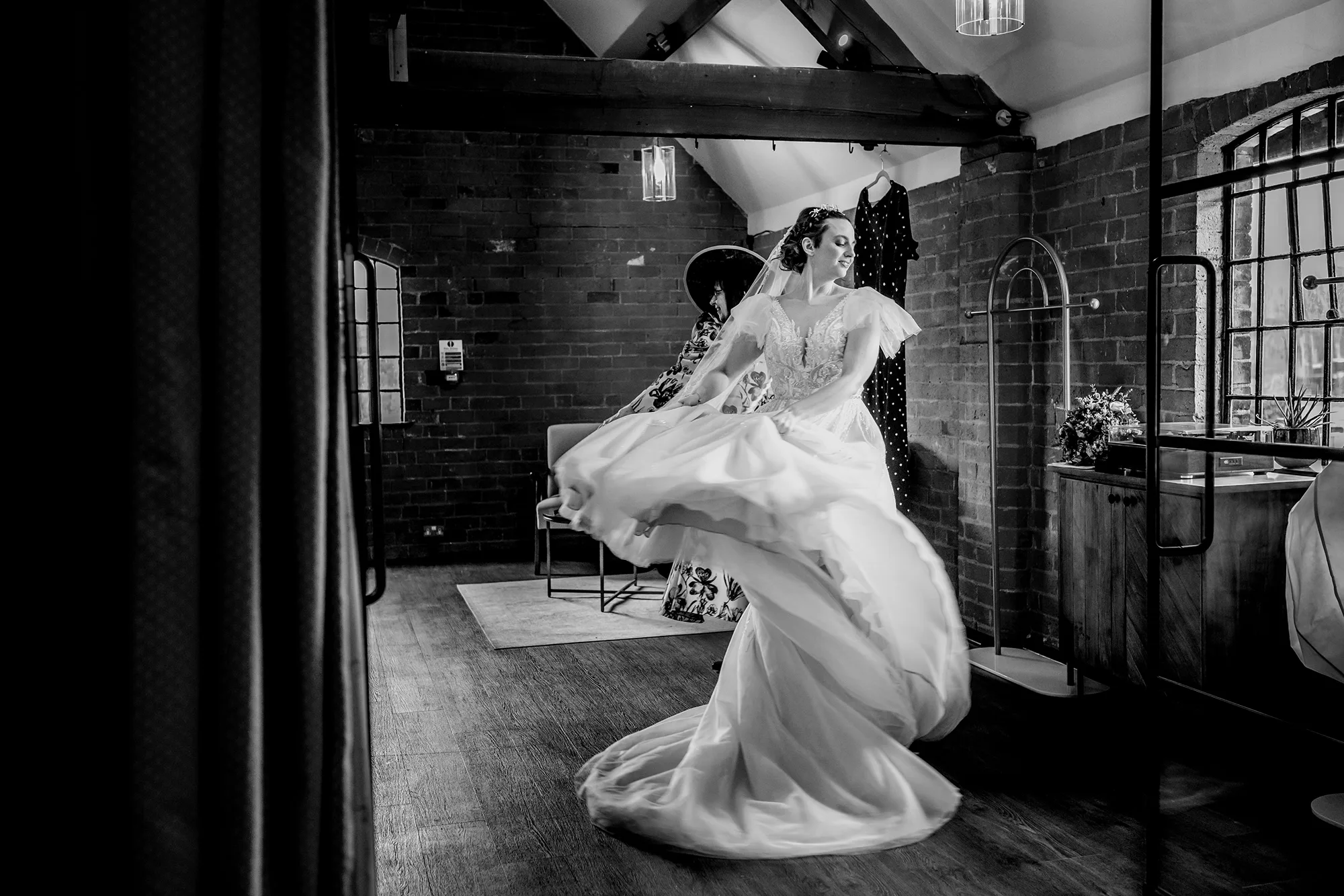 Bride twirling in her dress in the prep room at Blackbrook Barns, Lichfield, Staffordshire