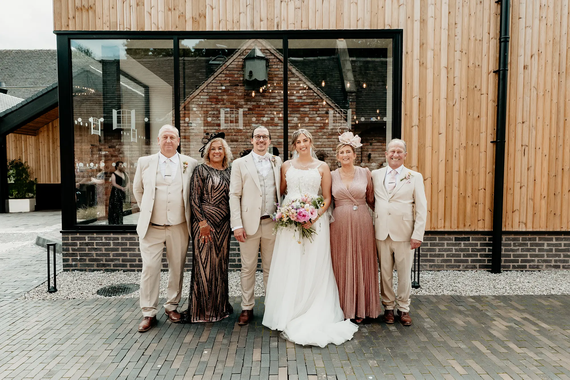 Family group portrait outside the venue at Blackbrook Barns, Lichfield, Staffordshire