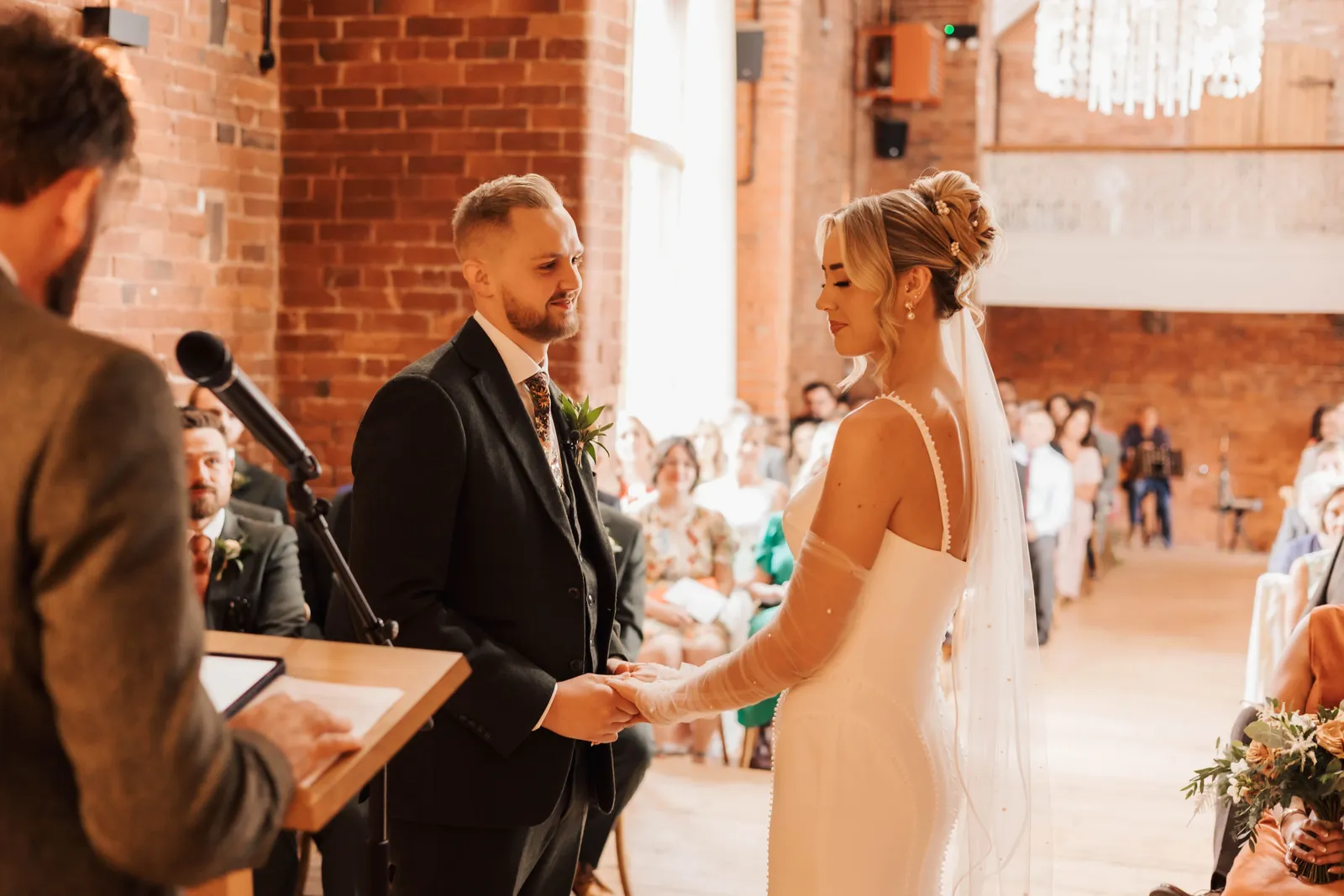 Couple exchanging vows during their ceremony at Blackbrook Barns, Lichfield, Staffordshire