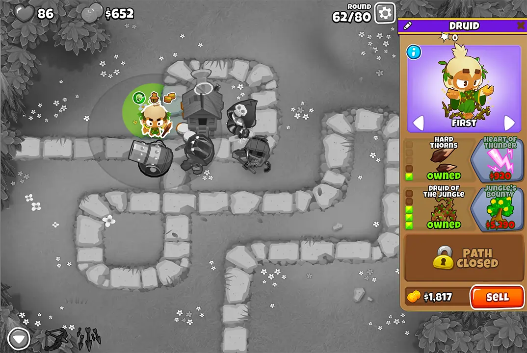 Bloons TD 6 screenshot of Round 62 on Monkey Meadow for Half Cash mode. The Druid is selected, showing its upgrades like Hard Thorns and Druid of the Jungle.