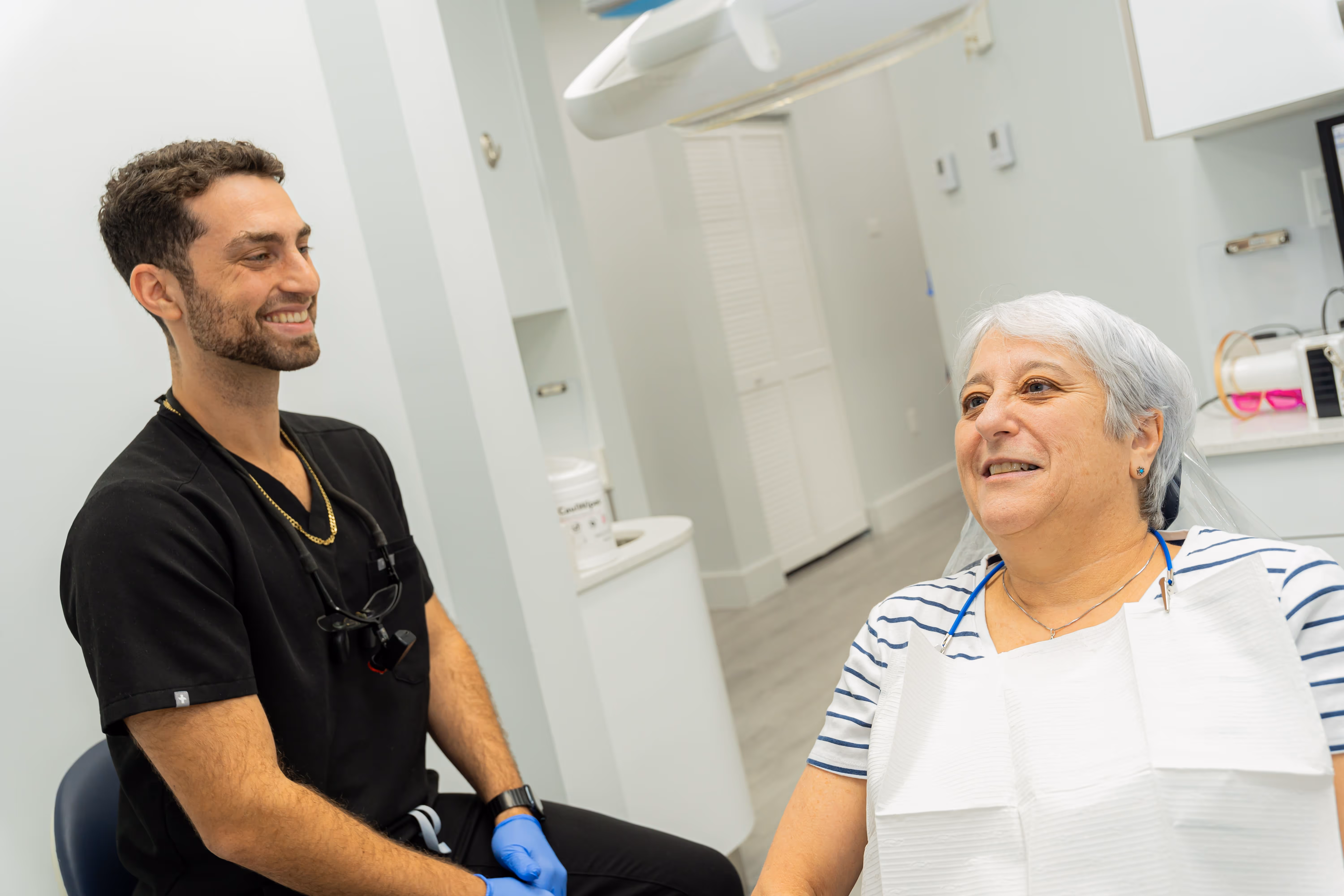 Dr. Jared Friedman providing dental care to a senior patient