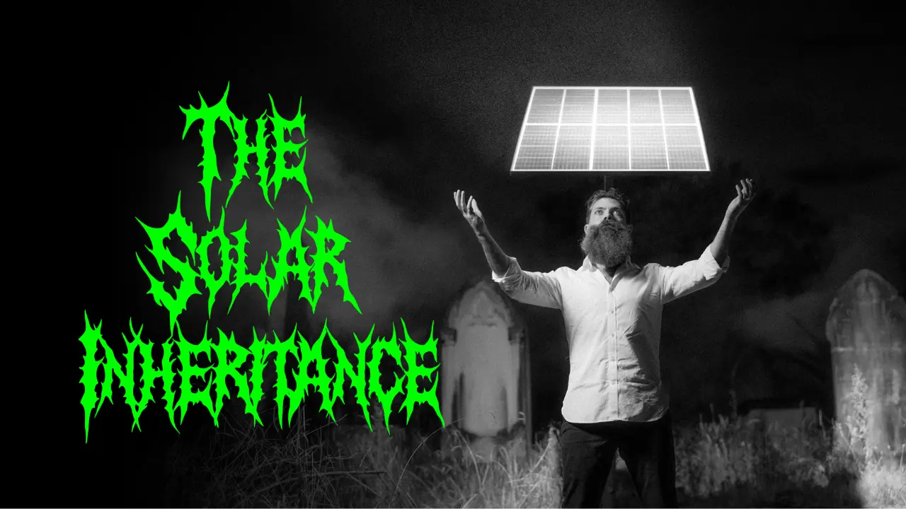 Co-Founder David Green standing in front of a solar panel placed in a grave yard, next to the bright green The Solar Inheritance logo.