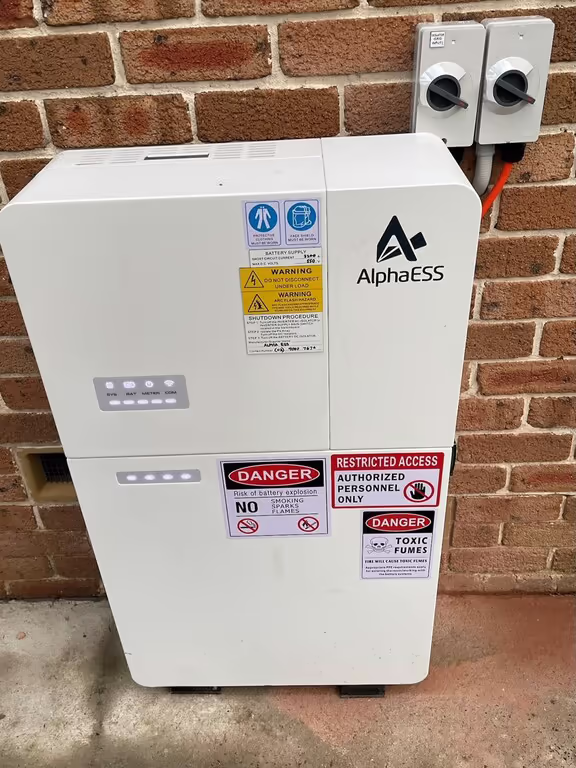 Alpha ESS battery installed against a brick wall